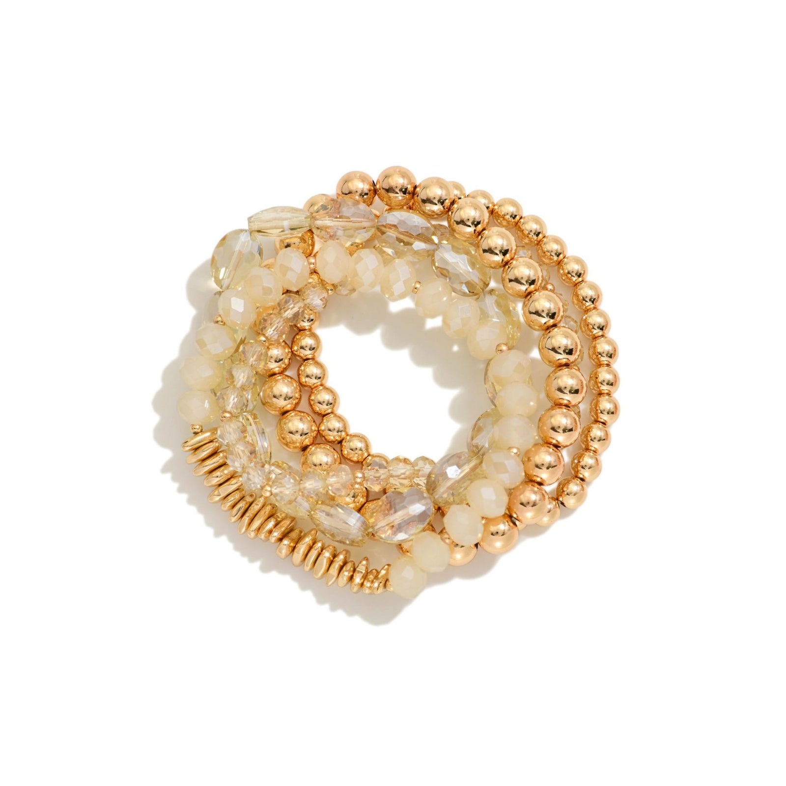 Set of gold and gray beaded bracelets on a white background